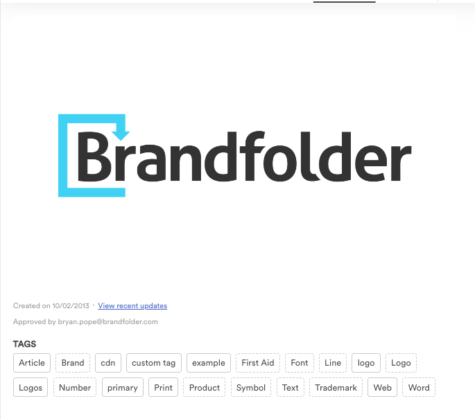 A brandfolder logo in the asset modal. Below the logo is the tags area. There are tags that have dotted line boarders like Brand which are auto generated. There are also tags with solid line boarders like Logos which are added by a user.